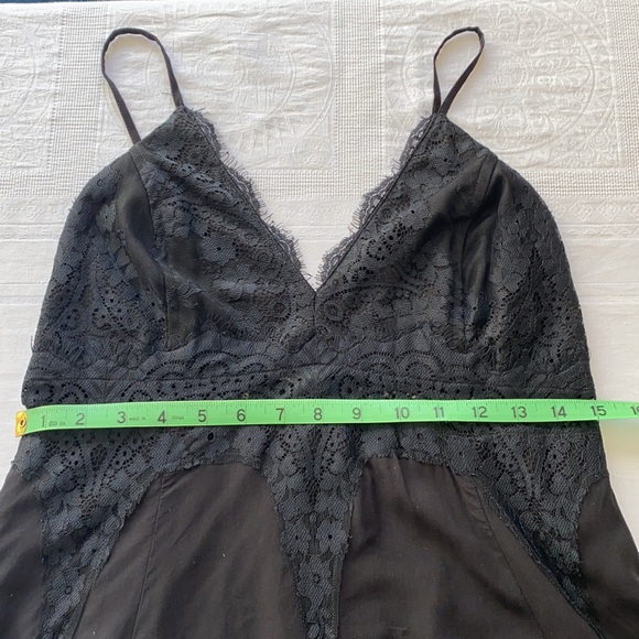Lush little black dress. Short flowy dress with fitted lace top. Size Med/Large. - Picture 10 of 10